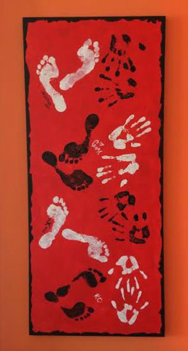Family hand & foot prints on canvas graced the wall in the living room.