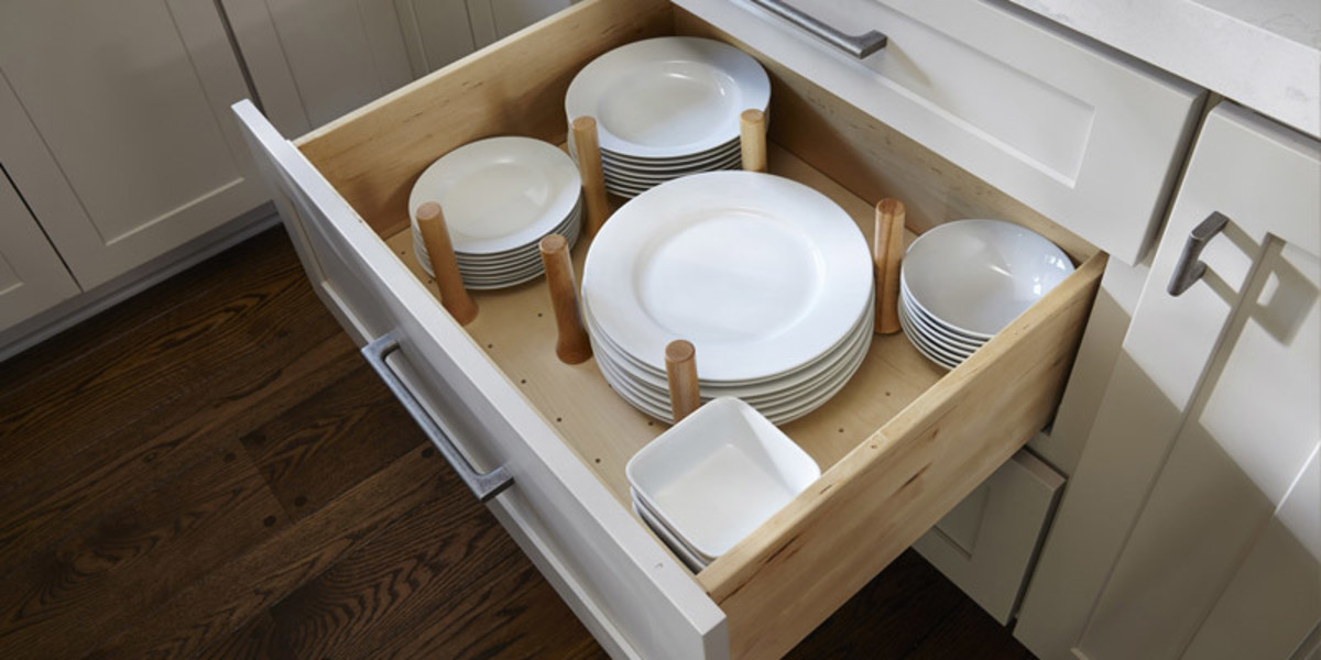 Store your plates and bowls in the drawers. The removable wood or metal pegs that organizes your dishes are in neat stacks.
