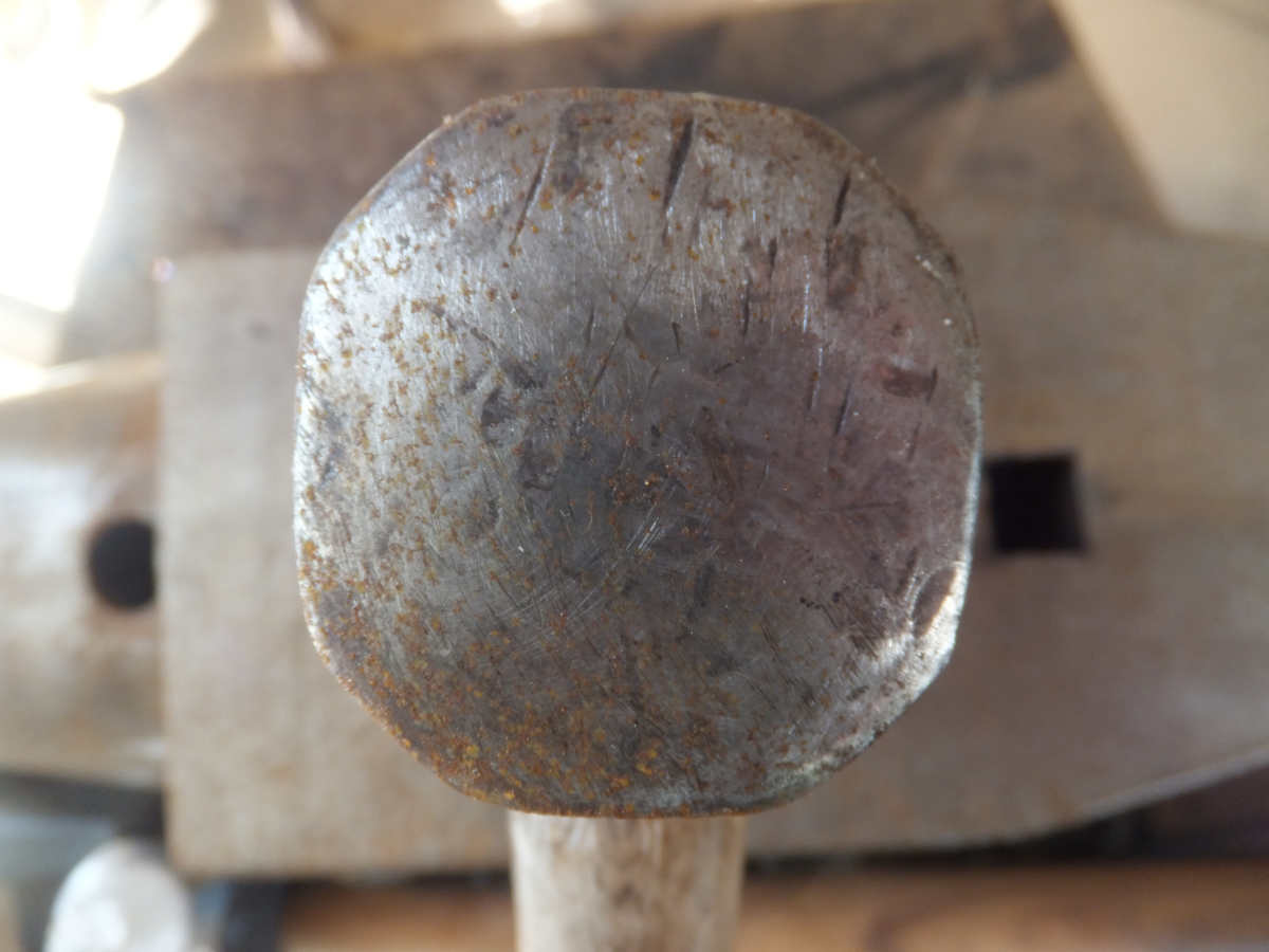 Damage at 12 o'clock and 2 o'clock position of blacksmith hammer.  This hammer needs to be redressed.