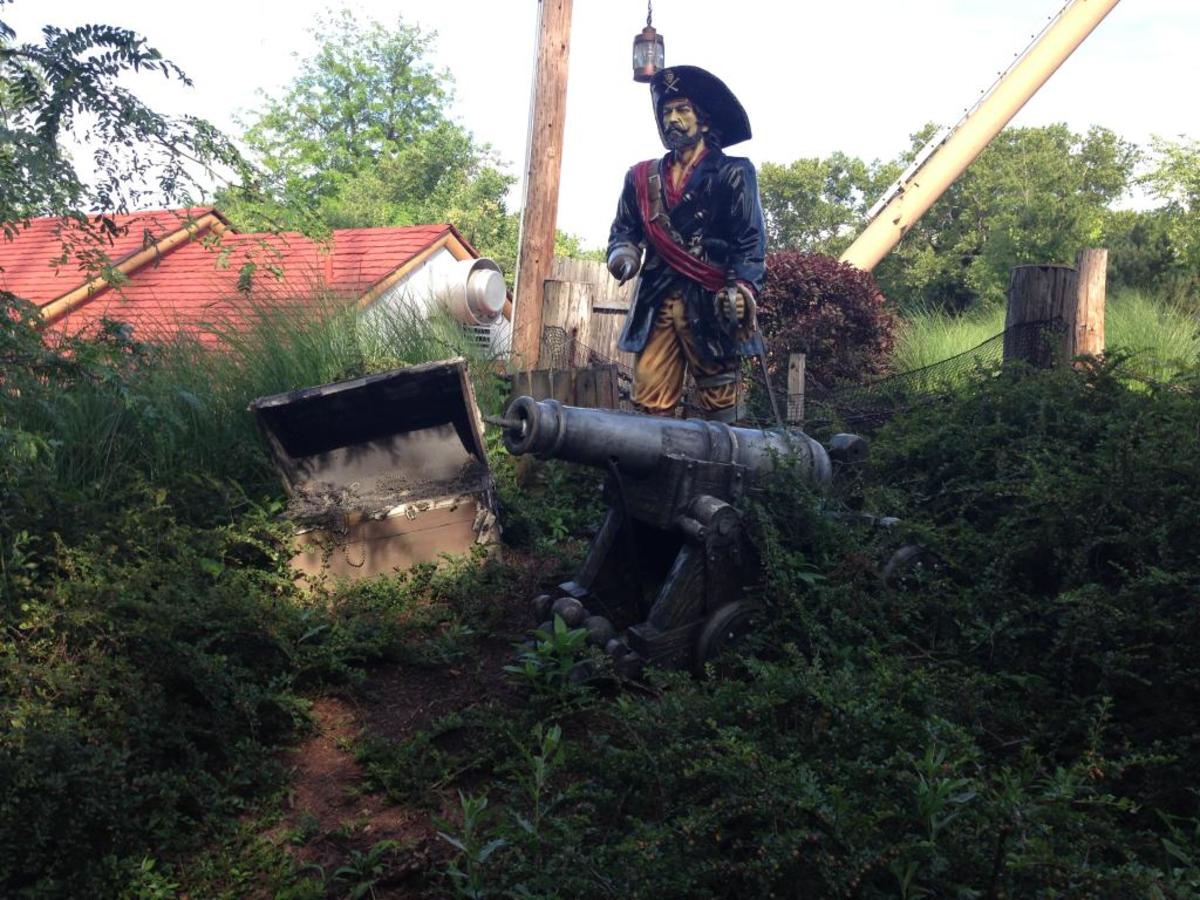 The pirate stands guard outside The Pirate ship ride.