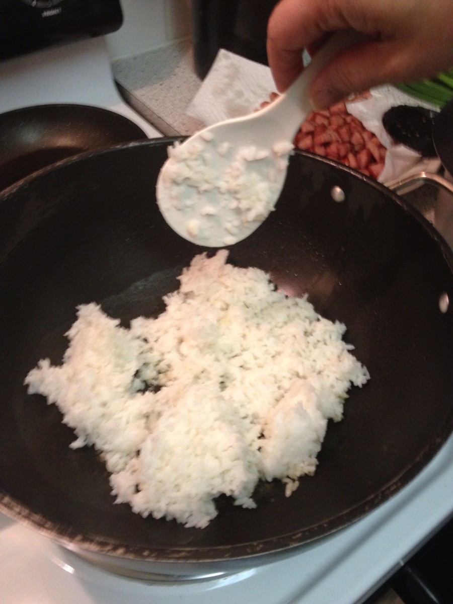 with a clean wok, add butter and rice, constantly folding over on low/mid heat not allowing rice to burn on the bottom.