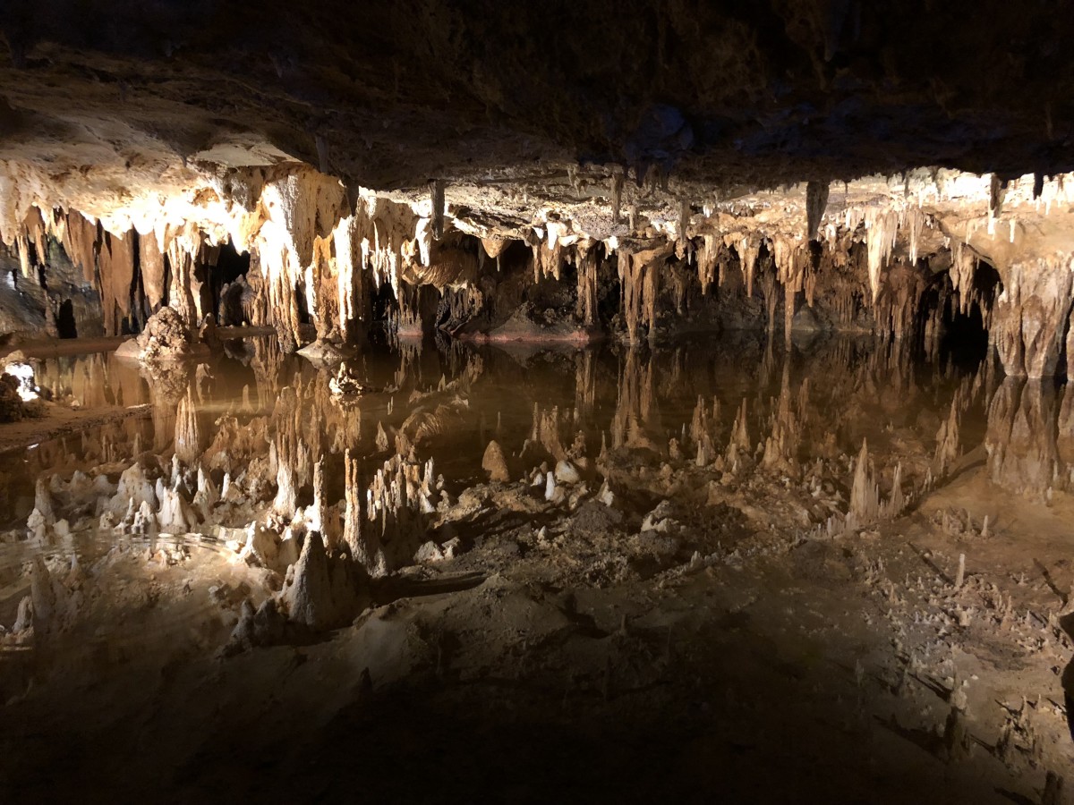 The Luray Caverns were discovered after a group of explorers noticed cool air emanating from a sinkhole near a limestone outcrop. 