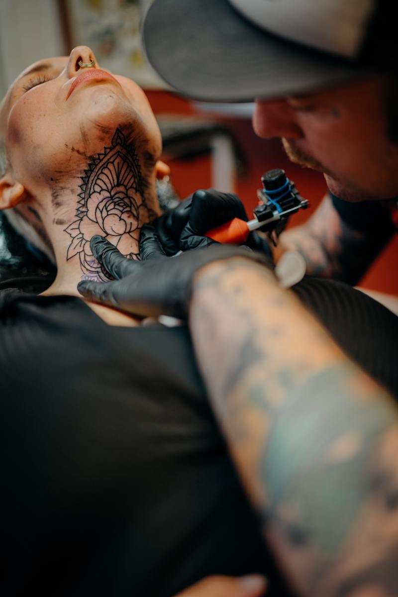 The neck is a notoriously painful spot for a tattoo. 
