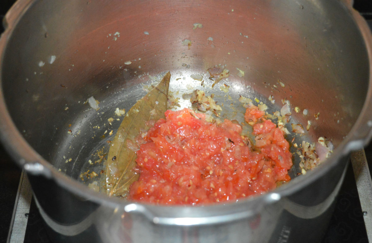 Add chopped tomatoes and some salt. Increase the heat and saute for 2-3 minutes.