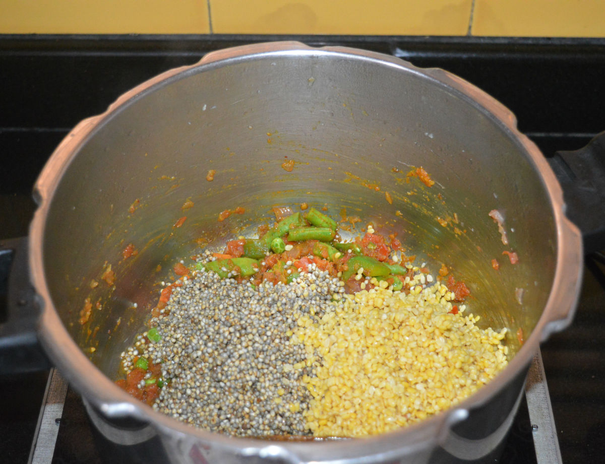 Step three: Add pearl millet and moong dal.