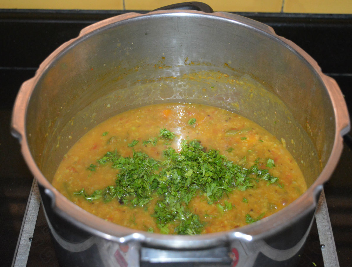 Open the cooker lid once the pressure escapes from it naturally. Add chopped coriander leaves. Mix well.