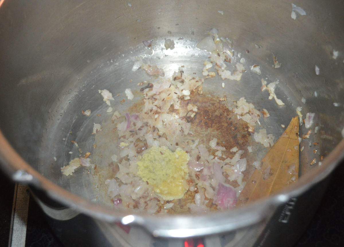 Add ginger-garlic paste. Continue sauteing until the raw smell from the ginger-garlic paste goes away.
