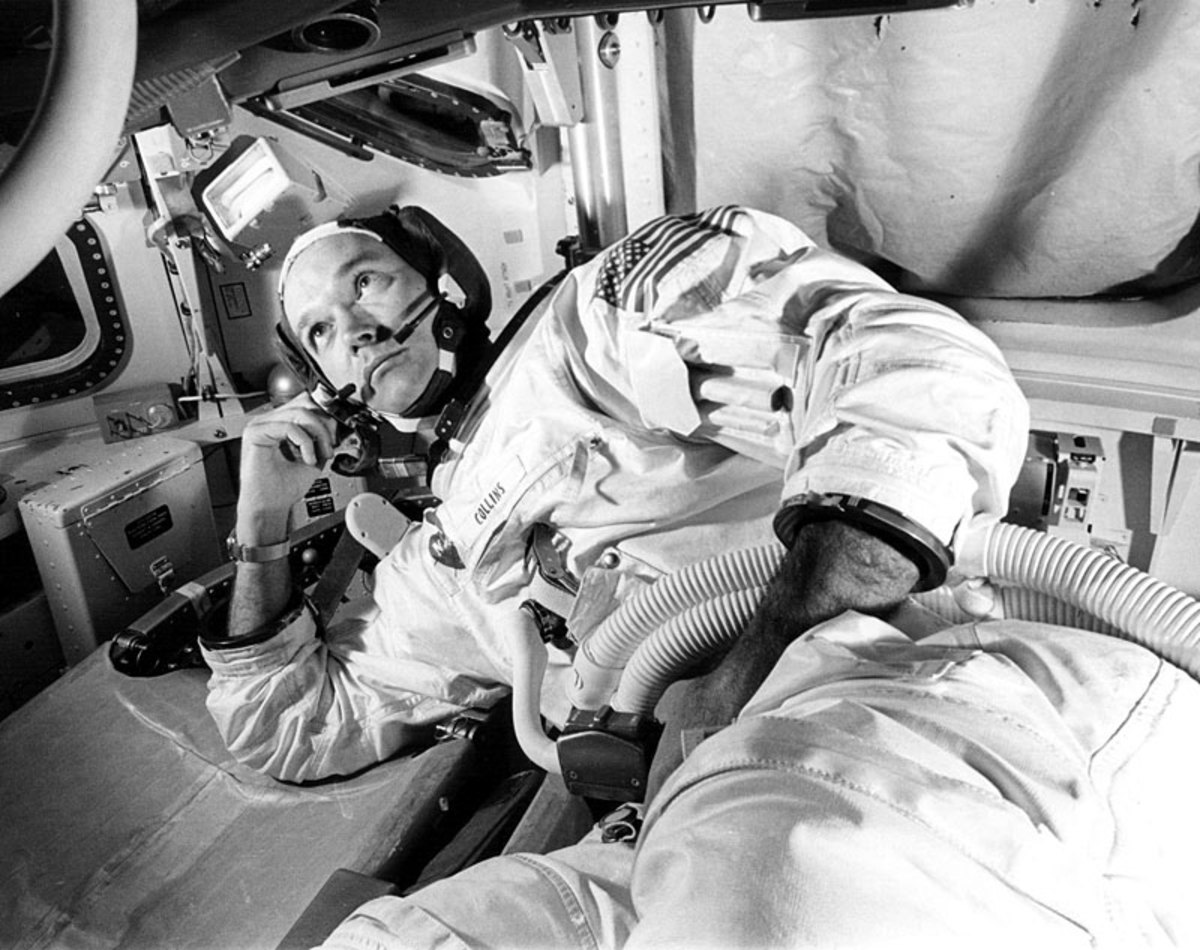 Michael Collins in Apollo 11 Command Module simulator during simulated rendezvous and docking maneuver, June 1969.