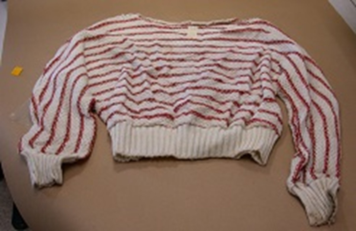 Valentine Sally was wearing this white sweater with red stripes. Photo courtesy of Missing Leads. 