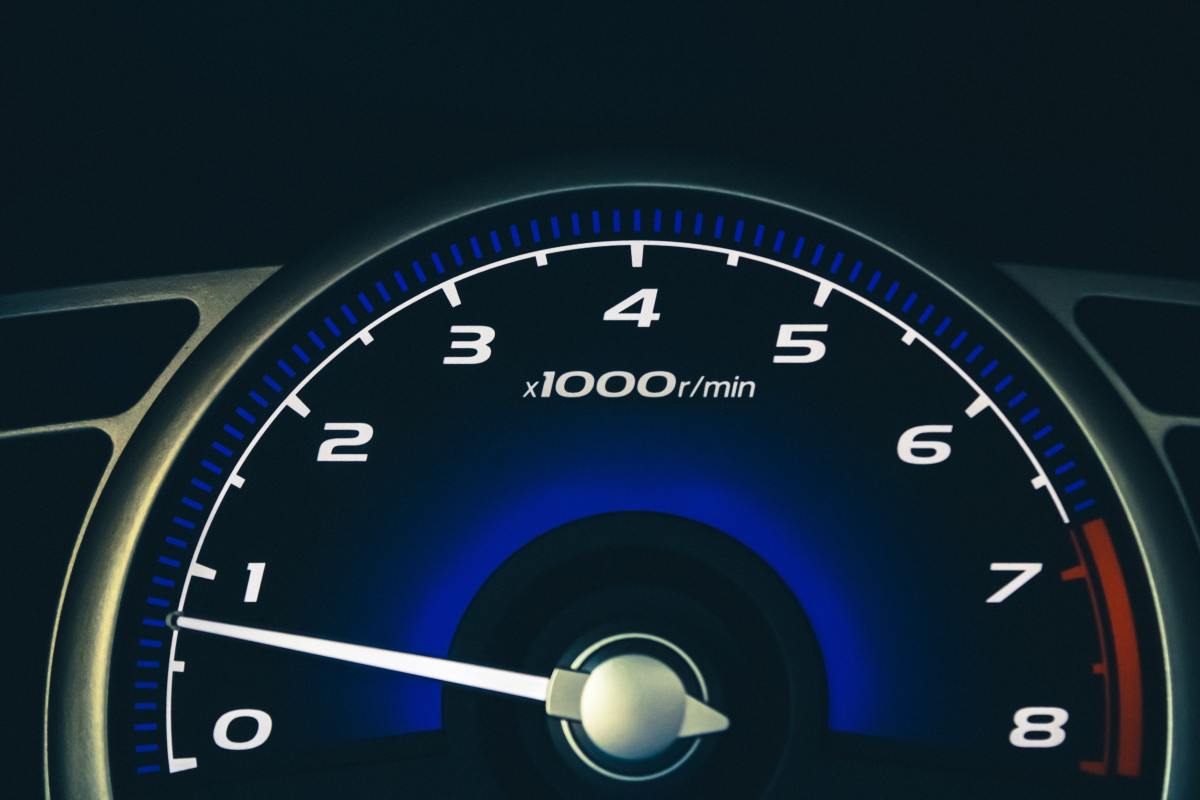 The tachometer tells you when to shift. Shift down when the tachometer reads about 1 or 1,000 RPM (and up at 3 or 3,000 RPM)