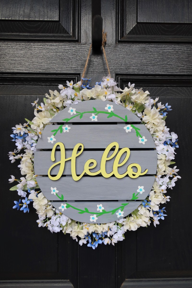 The finished wreath adds a rustic, farmhouse charm to your front door!