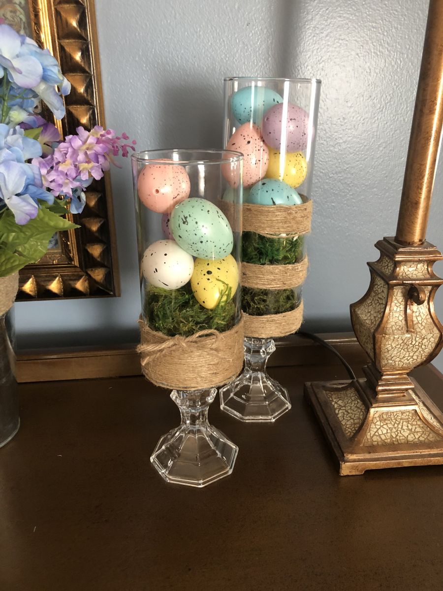 You can't get much simpler (or prettier) than this: eggs and faux moss in clear vases.