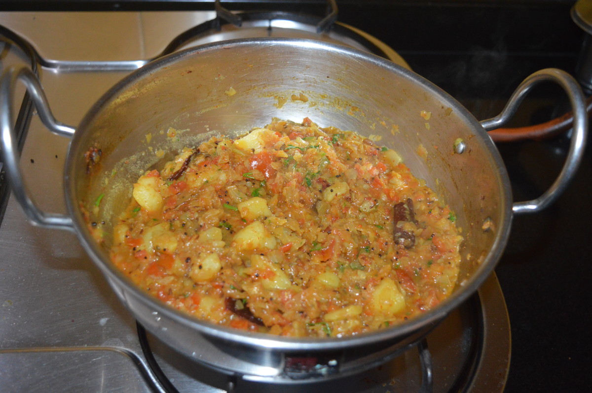Your favorite Bengali-style cabbage and potato curry is ready to serve! Transfer it to a serving dish. 