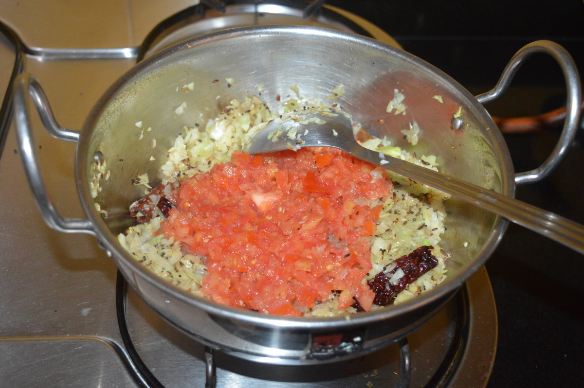 Add chopped tomatoes and cook until they become mushy. Add sugar and remaining salt. Mix well. 