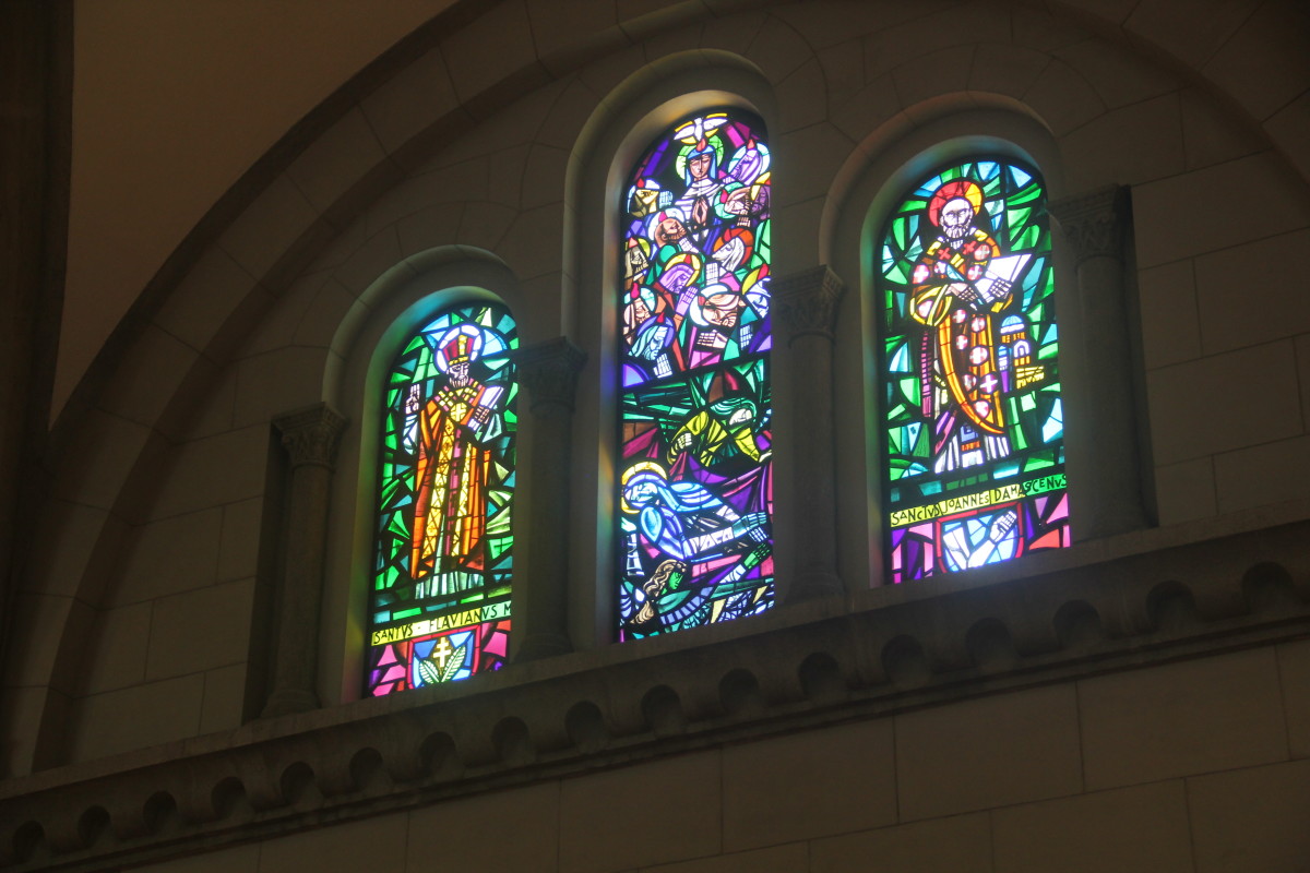 Notice the semi-circular arch on top of each stained glass window (Photo by the author)