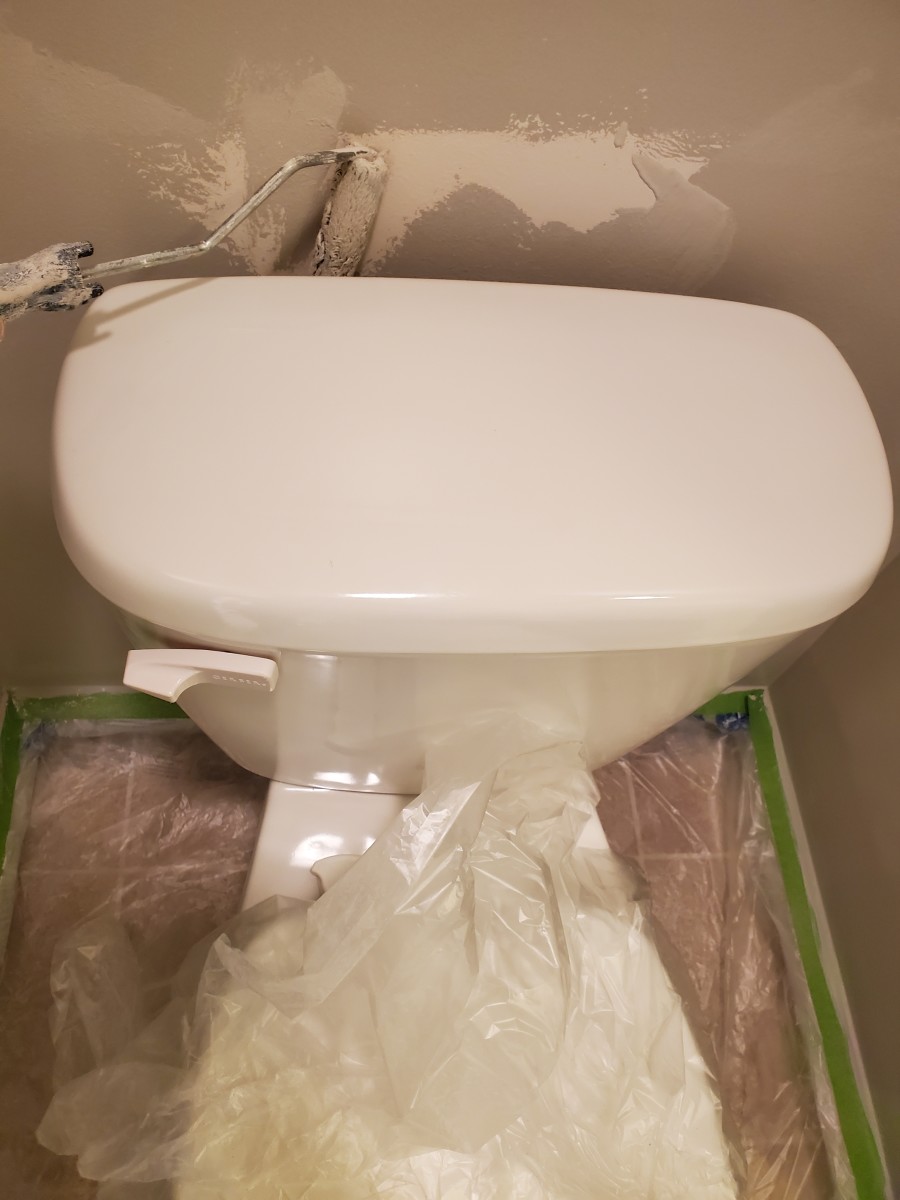 Use a mini roller to paint behind the toilet.