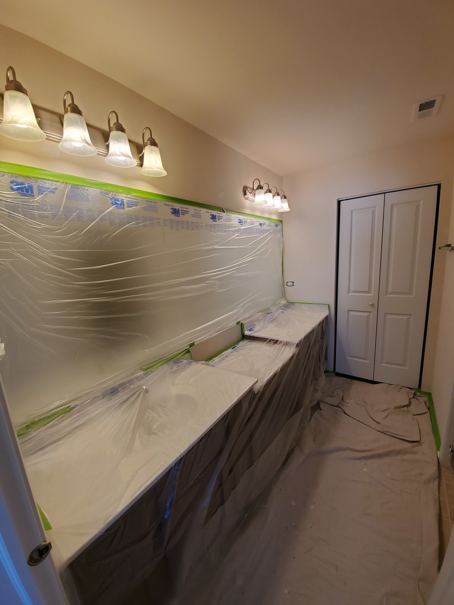 Carefully mask your bathroom before painting.