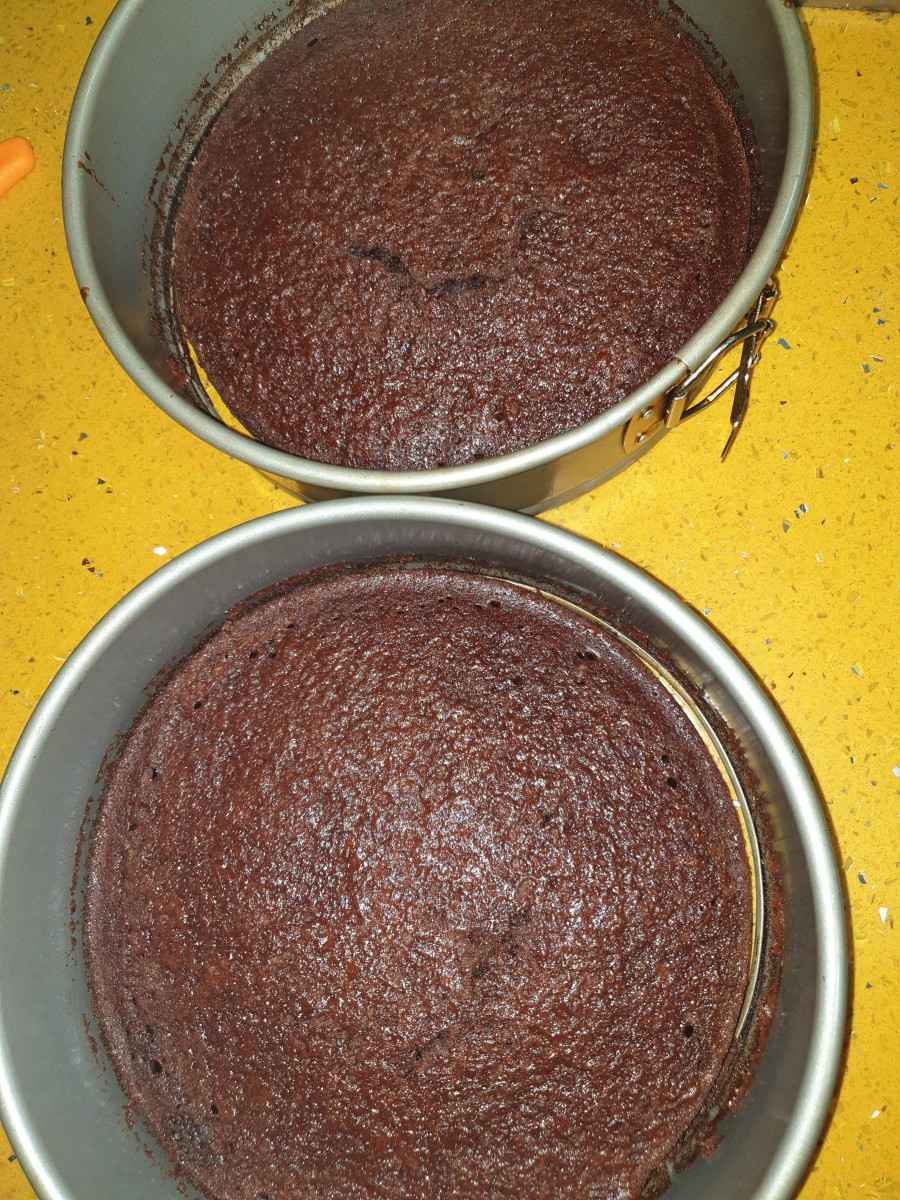 Two cake tins filled with my easy moist fool proof no scales required chocolate cake 