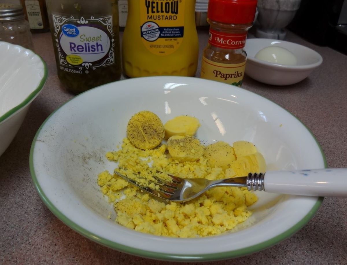 Mash the cooked yolks with a fork.
