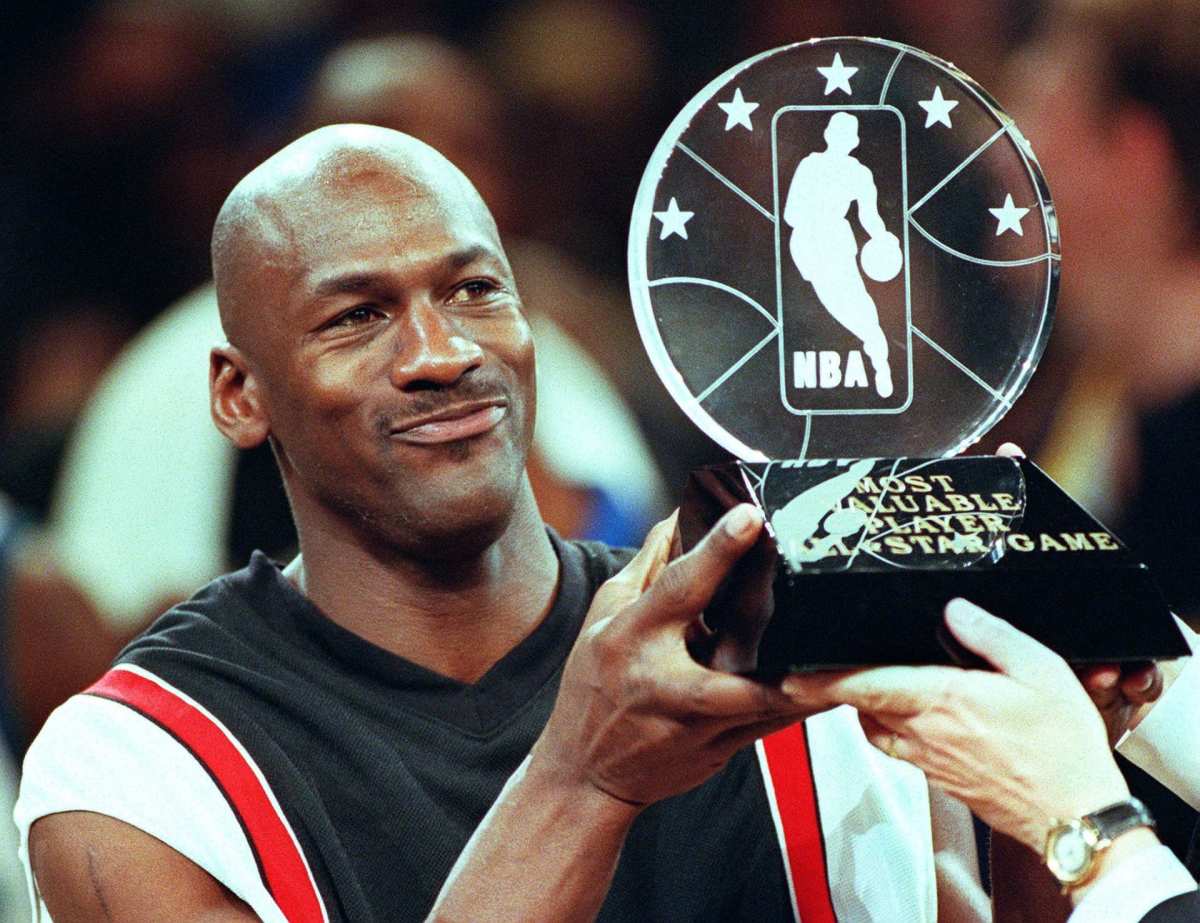 Michael holding a well-deserved All-Star Game MVP award