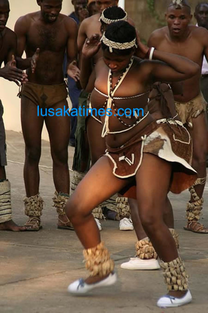 Male and Female Tswana Traditional Dancing int heir traditional clothes and moving the the music