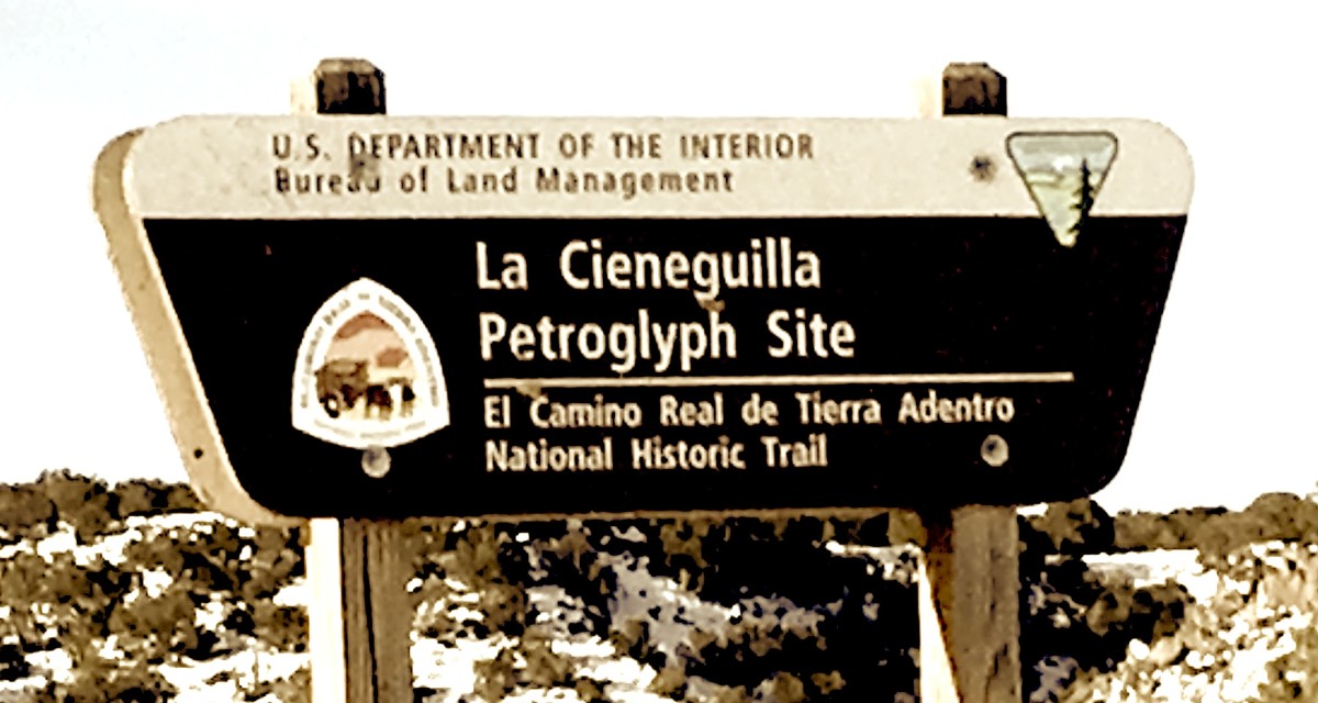 Entrance sign to the La Cieneguilla Petroglyph Site.
