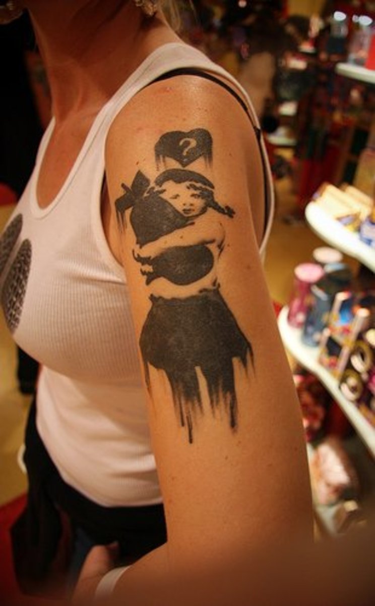 Banksy tattoo idea: Girl hugging a bomb