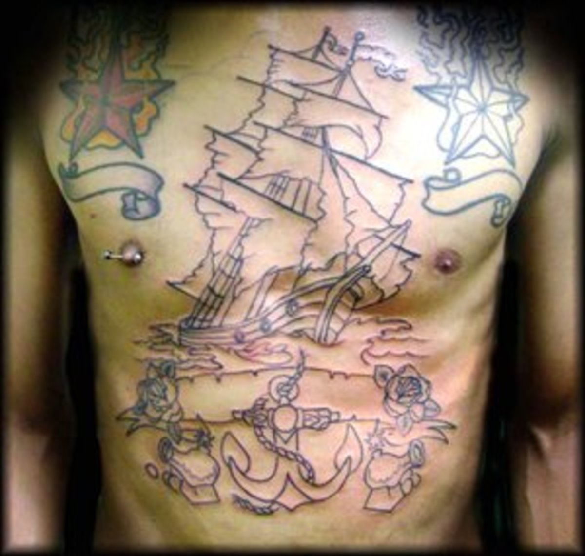 Outline of a Pirate Ship Tattoo on the Chest and Stomach
