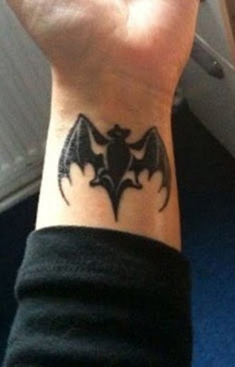 This Bacardi logo-themed bat tattoo is bold and beautiful. 