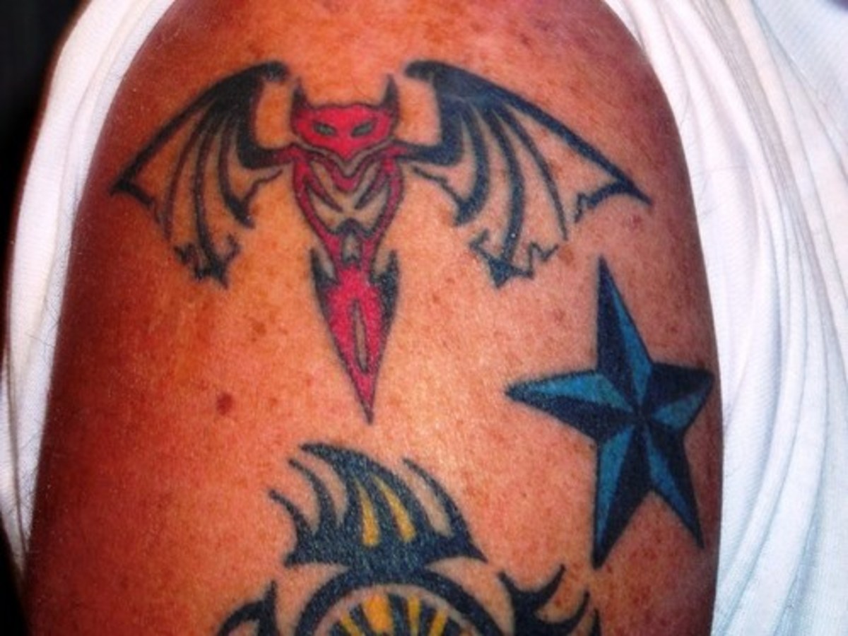This tattoo seems to incorporate components of the devil into a more traditional bat design. 
