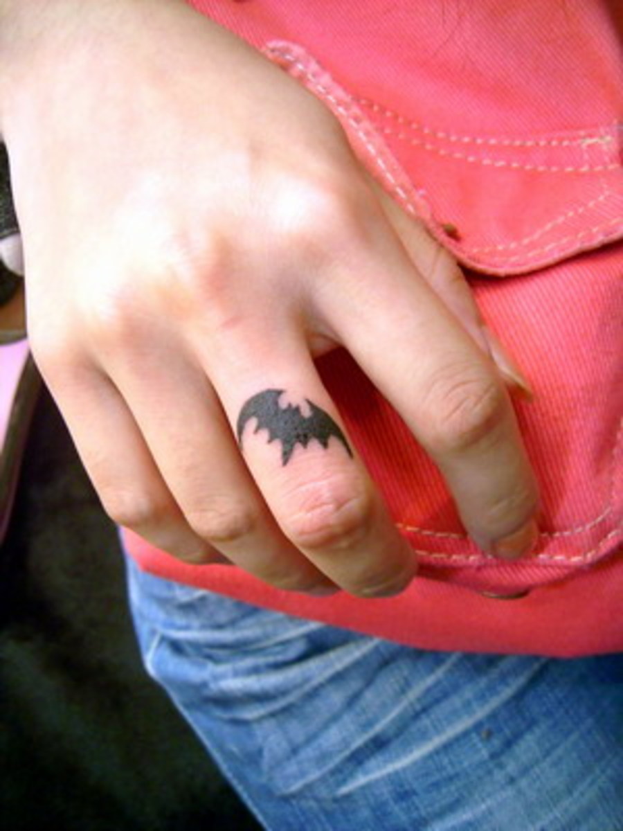 The unique placement makes this bat tattoo particularly striking. 