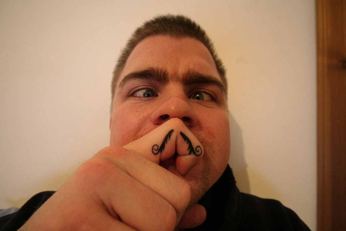 Moustache on Finger Tattoo Idea