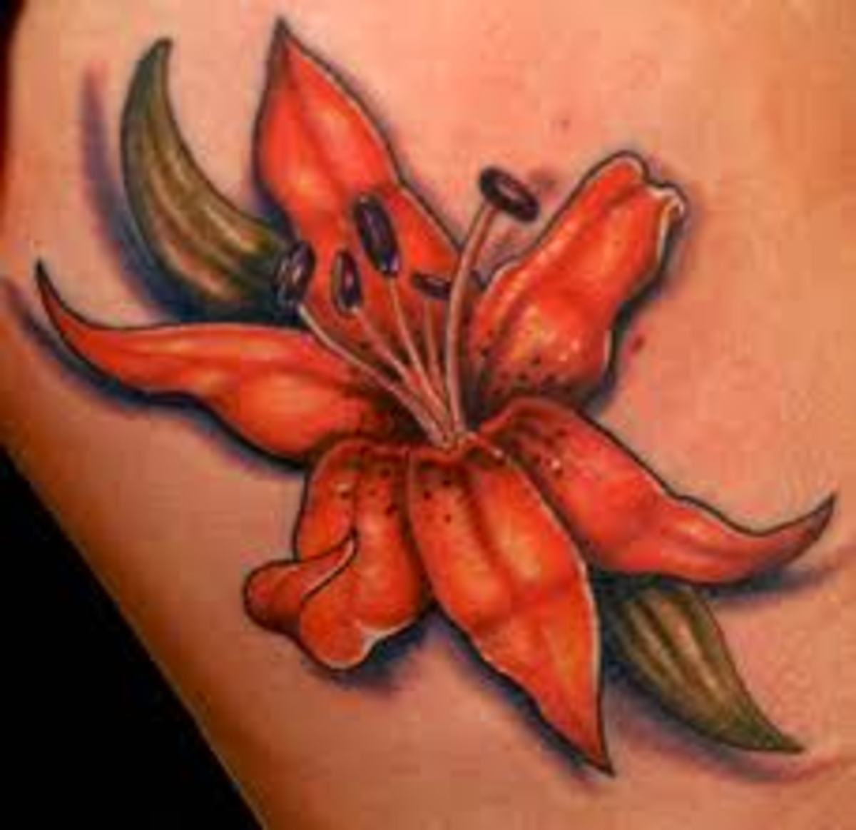 Лилия оранжевого цвета тату