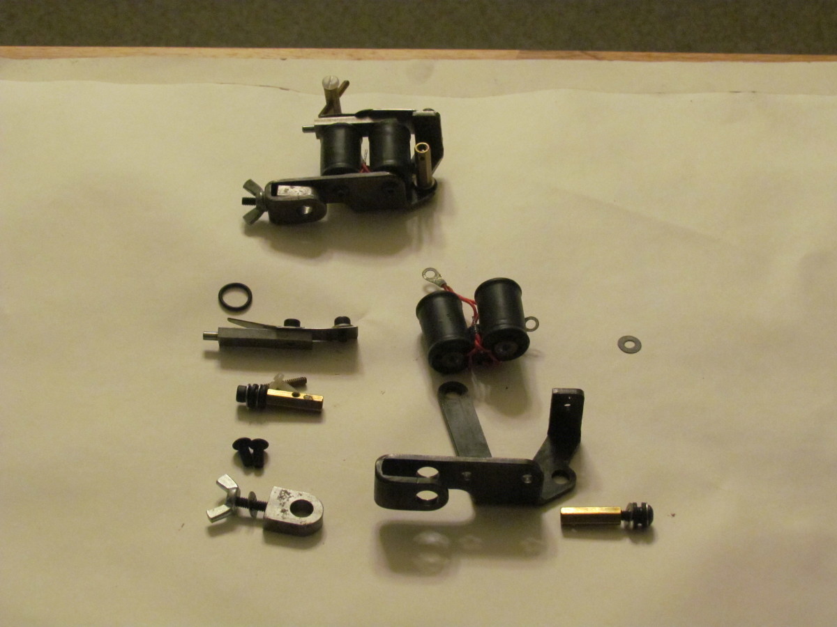 Same type of tattoo machine above as the disassembled one.