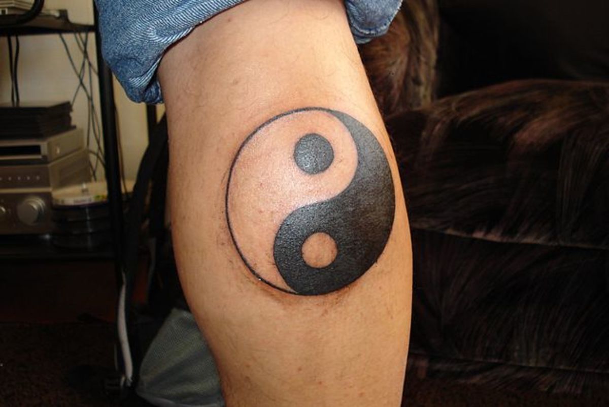 A large yin yang tattoo.