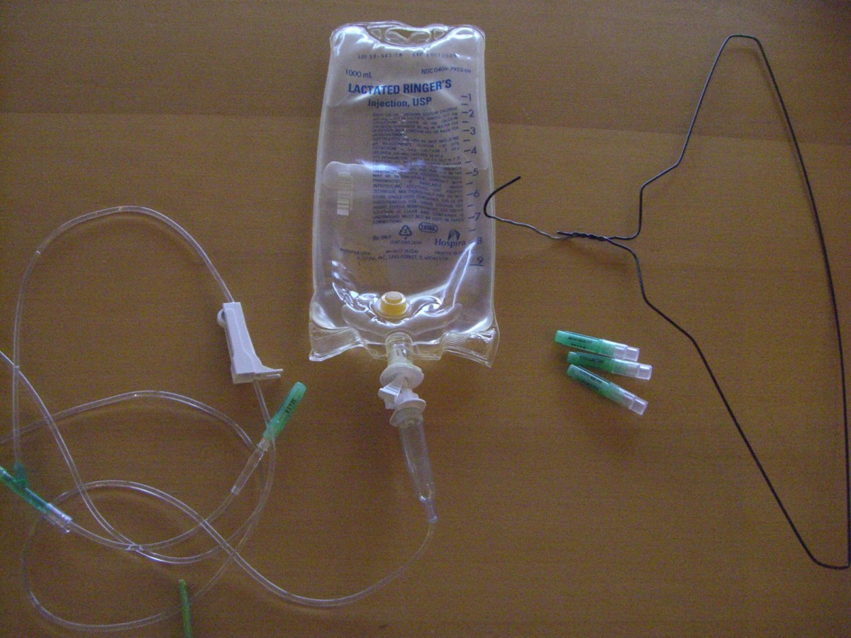 A bag of fluid connected to an administration set, needles, and a coat hanger will do the job.