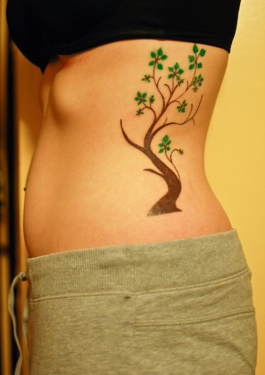 Bodhi tree rib tattoo.