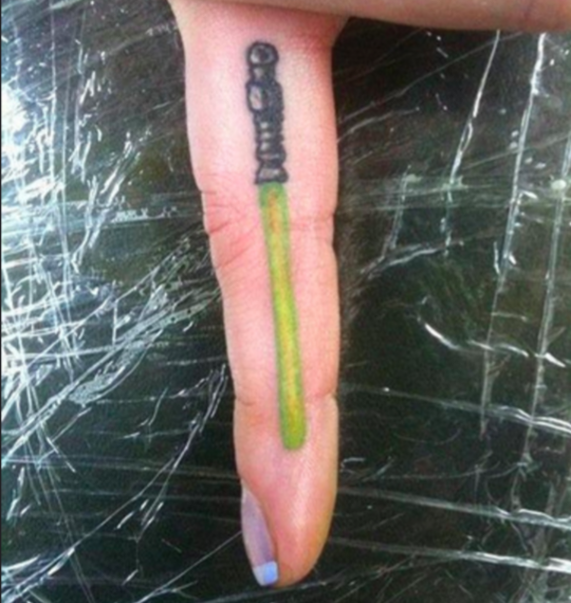 Light saber finger tattoo