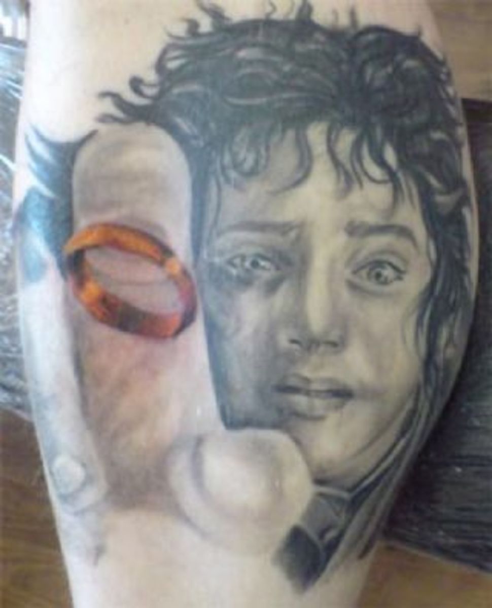 This tattoo of Frodo falling at the inn is in black except for the ring, which is in color. 