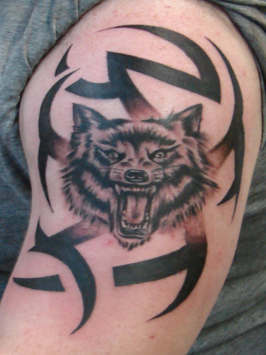 My attempt drawing a tribal wolf tattoo. : r/pics