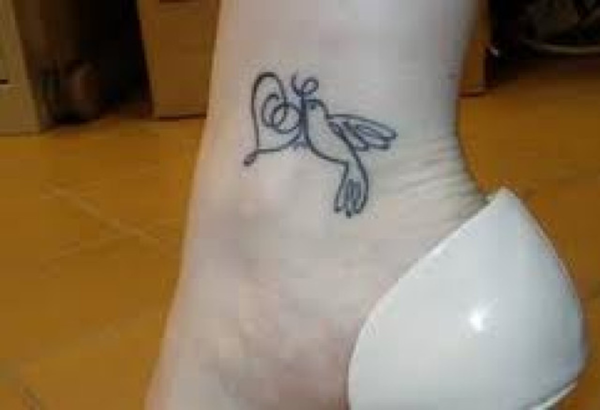 Small Dove Tattoo on a Woman's Ankle.