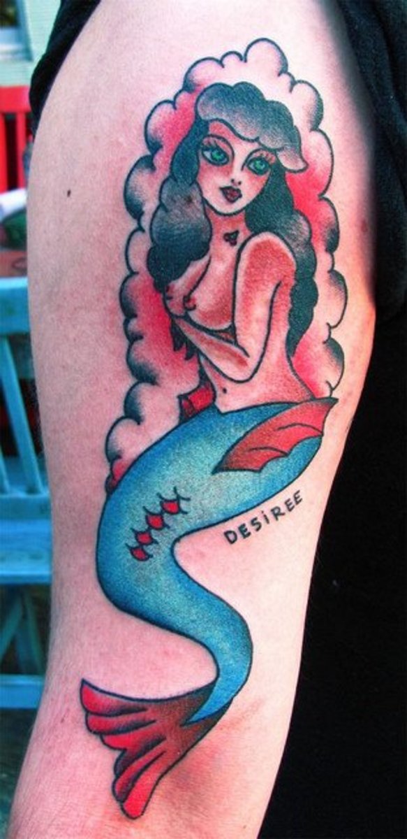 Very bright colors in this mermaid tattoo...and pin-up style