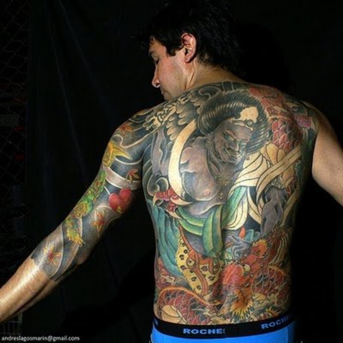 Example of a traditional full back and arm tattoo