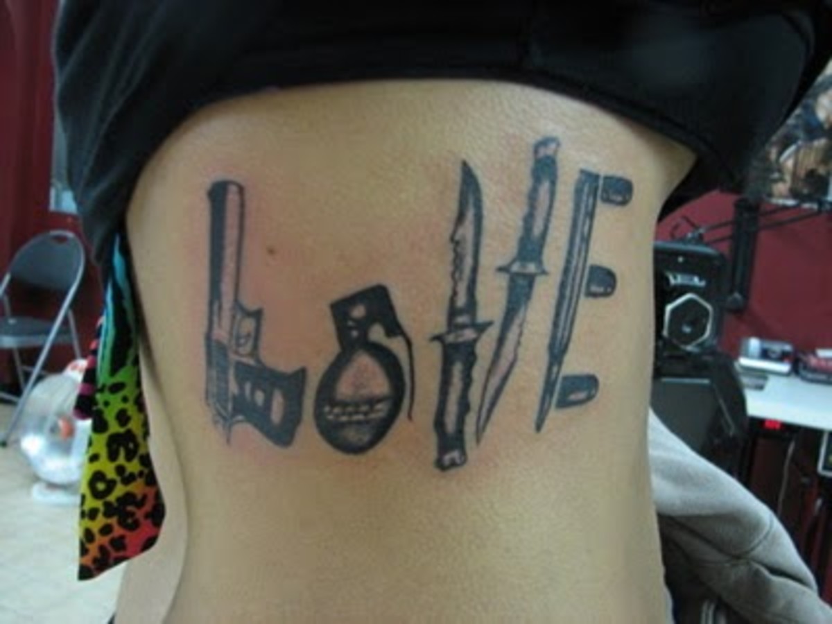 This tattoo uses weapons to spell out the word love! How unique is that?