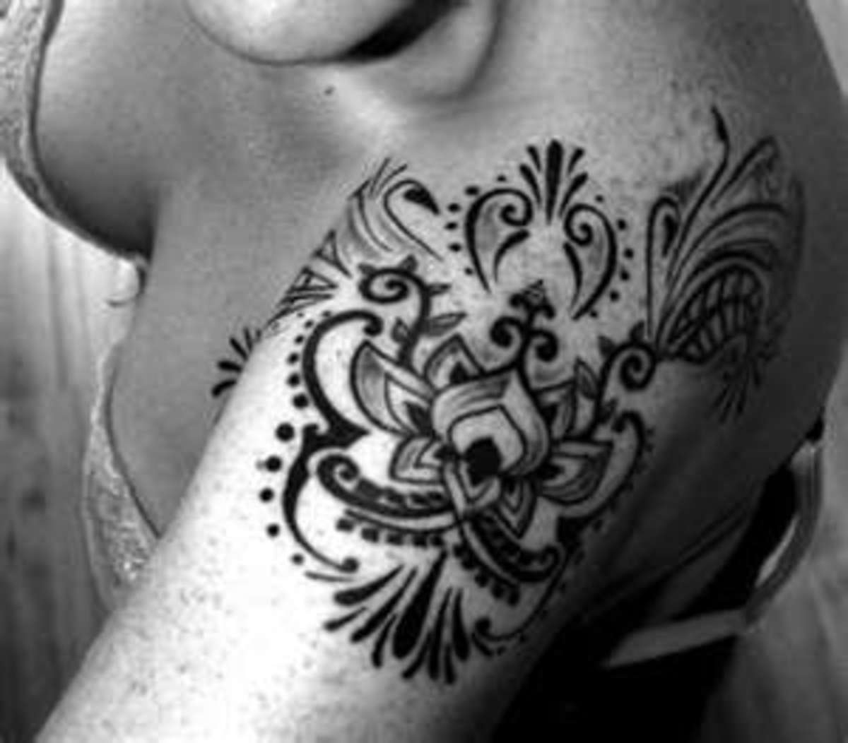 tribal tulip tattoo on shoulder