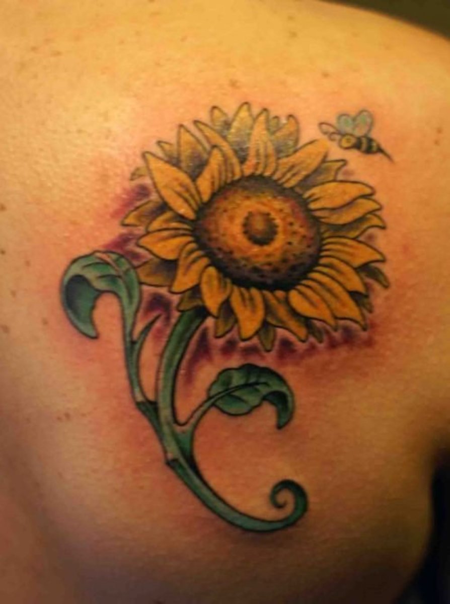 Sunflower and bee tattoo.