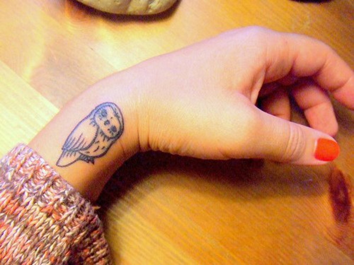 Татуировки для девушек на руке маленькие