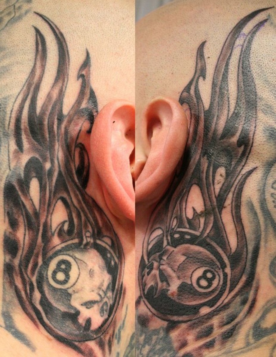 Eight ball tattoos behind the ear.