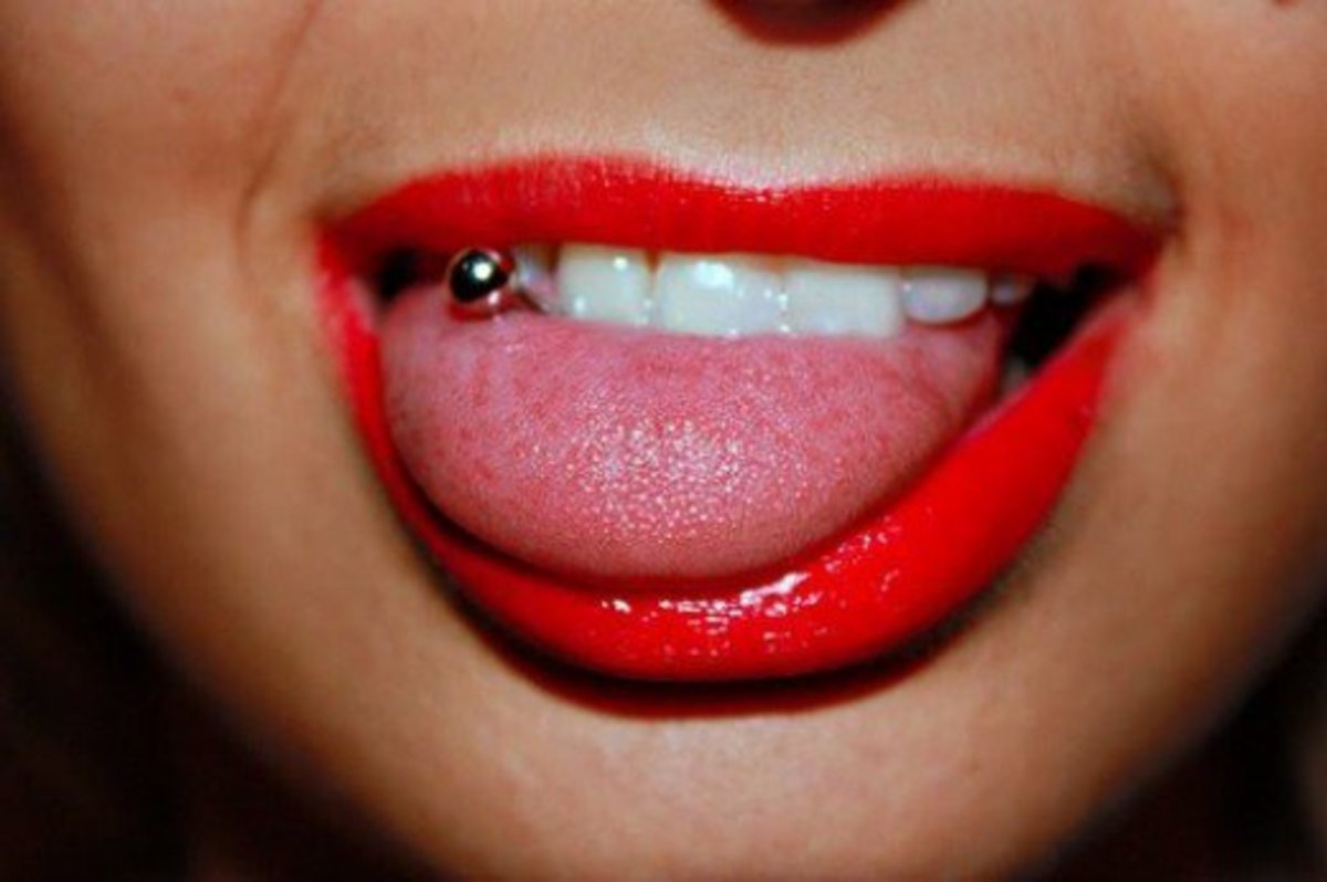 a close-up of a woman with her tongue pierced