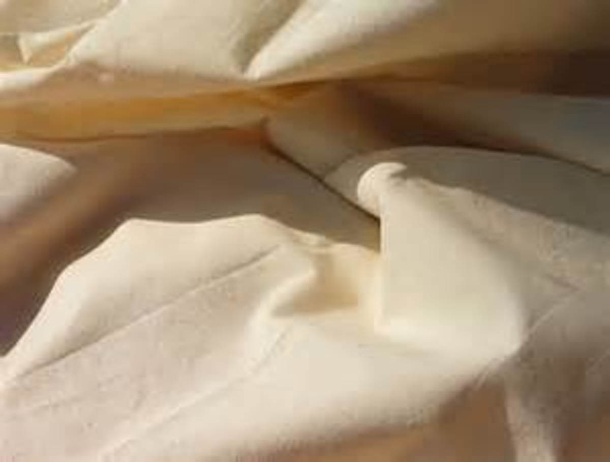 Cheese cloth or muslin cloth are ideal for wrapping a new tattoo and allowing it to breathe.
